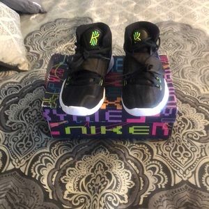 Nike sneakers size 5 color is black with green to yellow accents